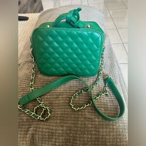 Green bag with gold accents